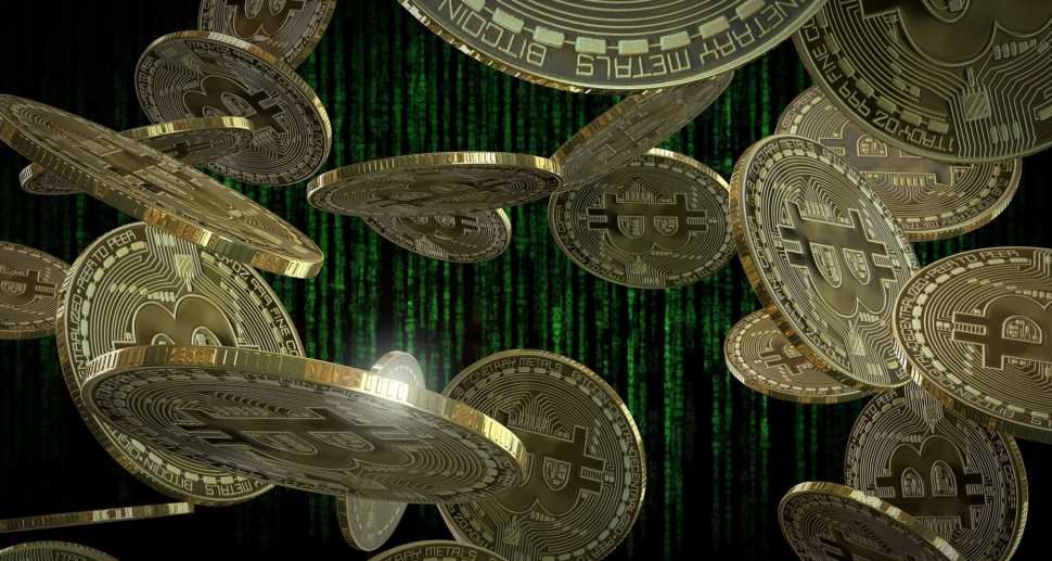Foto com Bitcoins caindo.