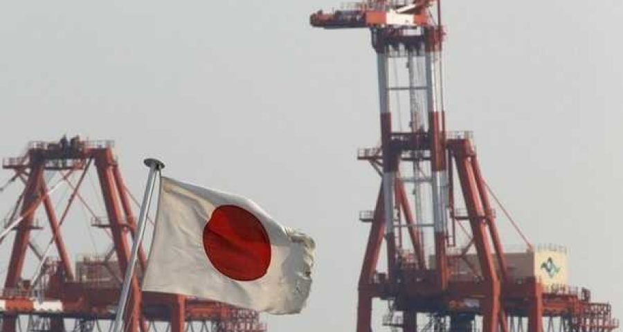 A Japanese national flag flies in front of cranes at an industrial port in Tokyo August 15, 2011. Japan's economy contracted at a slower pace than expected in the second quarter as output and exports recovered from the deadly earthquake in March, but a soaring yen and slowing global growth cloud the outlook for an economy emerging from recession. REUTERS/Issei Kato (JAPAN - Tags: BUSINESS DISASTER EMPLOYMENT MARITIME)